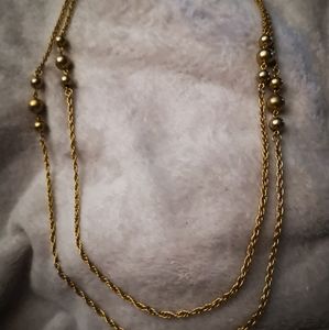 Very long gold tone necklace